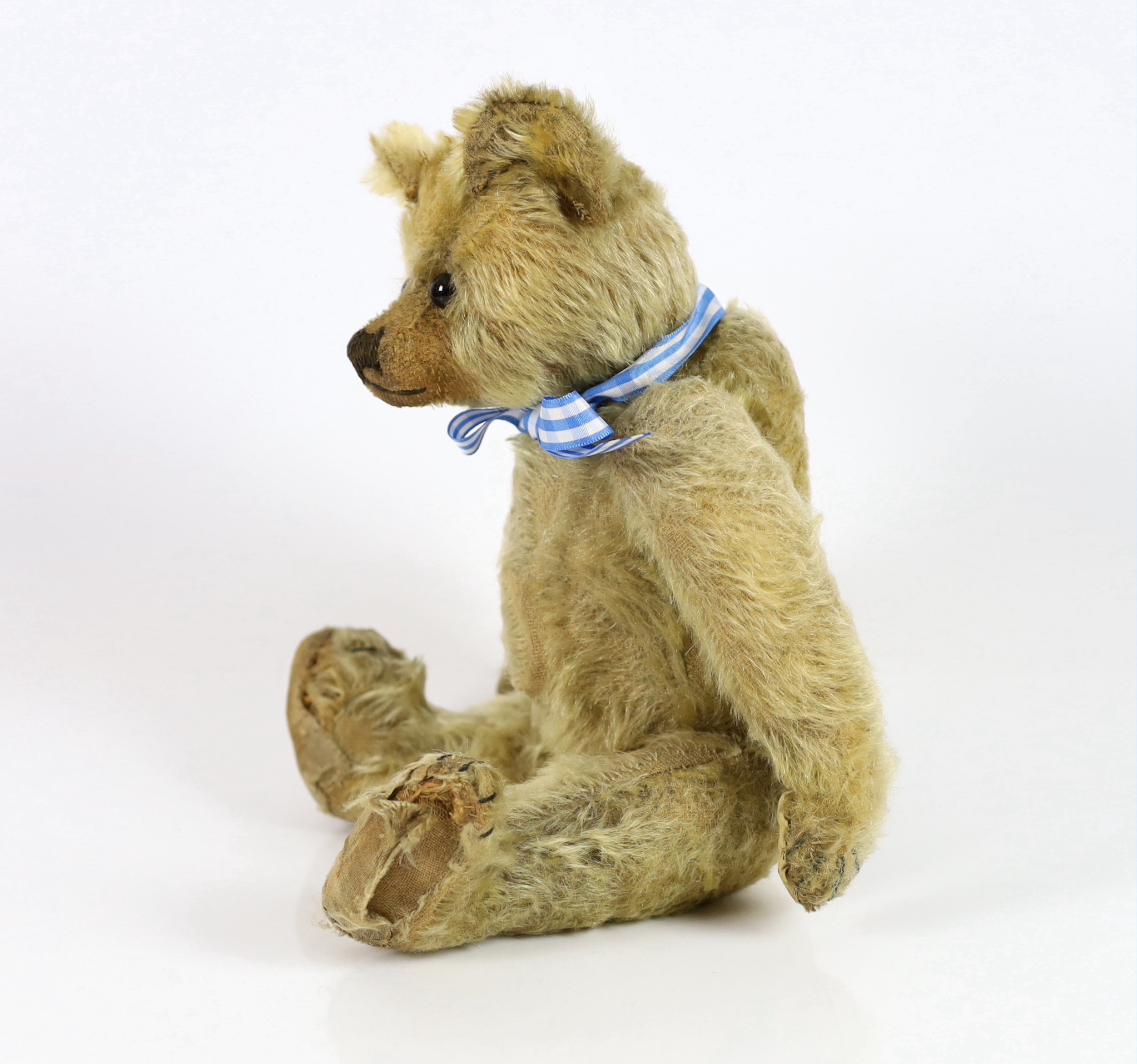 A Farnell bear, c.1912, 33cm, bear paw pads restored, hair loss to stomach